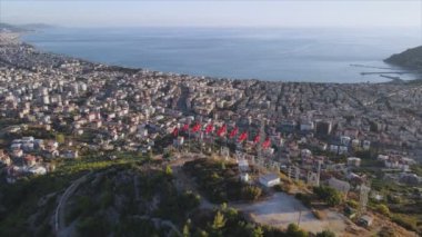 This stock footage shows aerial view of Alanya, Turkey - a resort town on the seashore in 8K resolution