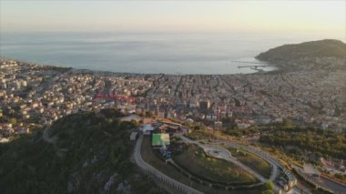 This stock footage shows aerial view of Alanya, Turkey - a resort town on the seashore in 8K resolution