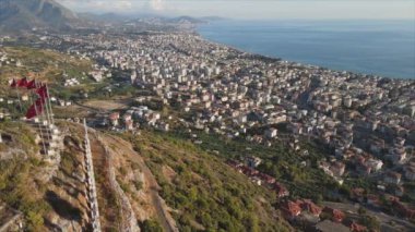This stock footage shows aerial view of Alanya, Turkey - a resort town on the seashore in 8K resolution