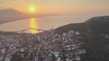 This stock footage shows aerial view of Alanya, Turkey - a resort town on the seashore in 8K resolution
