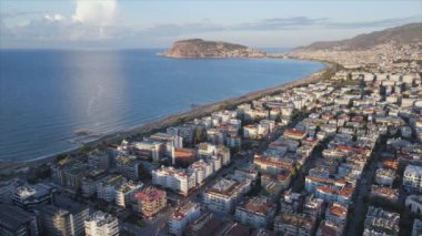 This stock footage shows aerial view of Alanya, Turkey - a resort town on the seashore in 8K resolution