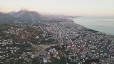 This stock footage shows aerial view of Alanya, Turkey - a resort town on the seashore in 8K resolution