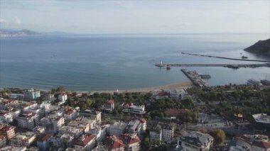 This stock footage shows aerial view of Alanya, Turkey - a resort town on the seashore in 8K resolution