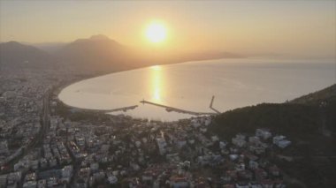 This stock footage shows aerial view of Alanya, Turkey - a resort town on the seashore in 8K resolution
