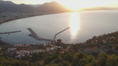 This stock footage shows aerial view of Alanya, Turkey - a resort town on the seashore in 8K resolution