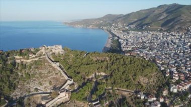 This stock footage shows aerial view of Alanya, Turkey - a resort town on the seashore in 8K resolution