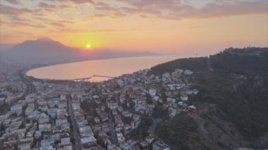 This stock footage shows aerial view of Alanya, Turkey - a resort town on the seashore in 8K resolution