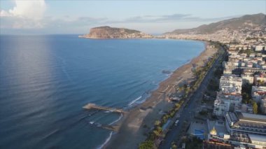 This stock footage shows aerial view of Alanya, Turkey - a resort town on the seashore in 8K resolution