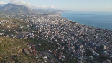 This stock footage shows aerial view of Alanya, Turkey - a resort town on the seashore in 8K resolution