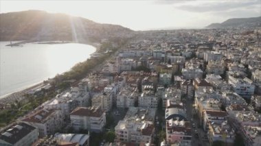 This stock footage shows aerial view of Alanya, Turkey - a resort town on the seashore in 8K resolution