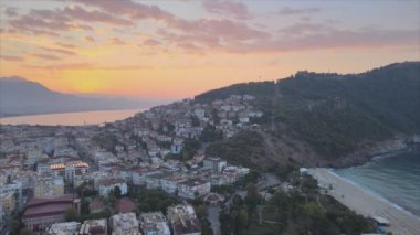 This stock footage shows aerial view of Alanya, Turkey - a resort town on the seashore in 8K resolution