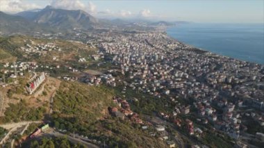 This stock footage shows aerial view of Alanya, Turkey - a resort town on the seashore in 8K resolution
