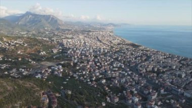 This stock footage shows aerial view of Alanya, Turkey - a resort town on the seashore in 8K resolution
