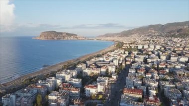 This stock footage shows aerial view of Alanya, Turkey - a resort town on the seashore in 8K resolution