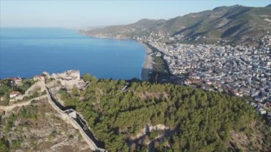 This stock footage shows aerial view of Alanya, Turkey - a resort town on the seashore in 8K resolution