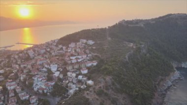 This stock footage shows aerial view of Alanya, Turkey - a resort town on the seashore in 8K resolution