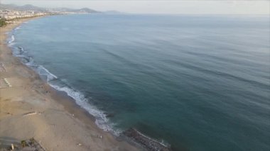 This stock footage shows aerial view of Alanya, Turkey - a resort town on the seashore in 8K resolution