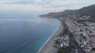 This stock footage shows aerial view of Alanya, Turkey - a resort town on the seashore in 8K resolution