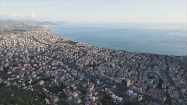 This stock footage shows aerial view of Alanya, Turkey - a resort town on the seashore in 8K resolution