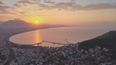 This stock footage shows aerial view of Alanya, Turkey - a resort town on the seashore in 8K resolution