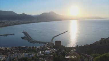 This stock footage shows aerial view of Alanya, Turkey - a resort town on the seashore in 8K resolution
