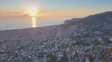 This stock footage shows aerial view of Alanya, Turkey - a resort town on the seashore in 8K resolution