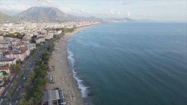 This stock footage shows aerial view of Alanya, Turkey - a resort town on the seashore in 8K resolution