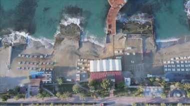 This stock footage shows aerial view of Alanya, Turkey - a resort town on the seashore in 8K resolution