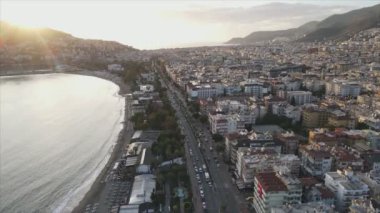 This stock footage shows aerial view of Alanya, Turkey - a resort town on the seashore in 8K resolution