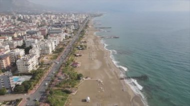 This stock footage shows aerial view of Alanya, Turkey - a resort town on the seashore in 8K resolution