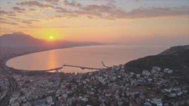 This stock footage shows aerial view of Alanya, Turkey - a resort town on the seashore in 8K resolution