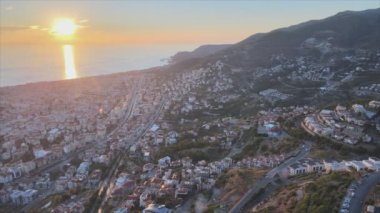 This stock footage shows aerial view of Alanya, Turkey - a resort town on the seashore in 8K resolution