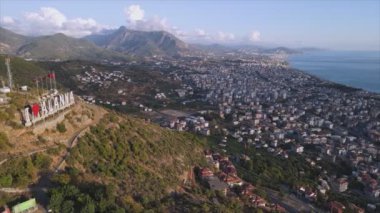 This stock footage shows aerial view of Alanya, Turkey - a resort town on the seashore in 8K resolution