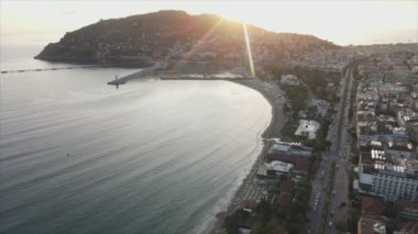 This stock footage shows aerial view of Alanya, Turkey - a resort town on the seashore in 8K resolution