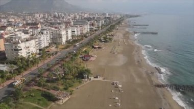 This stock footage shows aerial view of Alanya, Turkey - a resort town on the seashore in 8K resolution