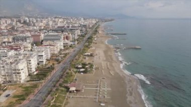 This stock footage shows aerial view of Alanya, Turkey - a resort town on the seashore in 8K resolution