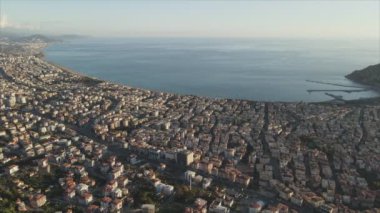 This stock footage shows aerial view of Alanya, Turkey - a resort town on the seashore in 8K resolution
