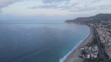 This stock footage shows aerial view of Alanya, Turkey - a resort town on the seashore in 8K resolution