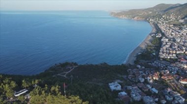 This stock footage shows aerial view of Alanya, Turkey - a resort town on the seashore in 8K resolution