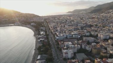 This stock footage shows aerial view of Alanya, Turkey - a resort town on the seashore in 8K resolution