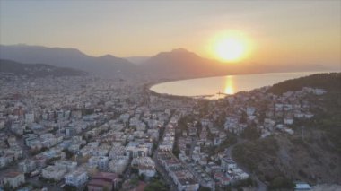 This stock footage shows aerial view of Alanya, Turkey - a resort town on the seashore in 8K resolution