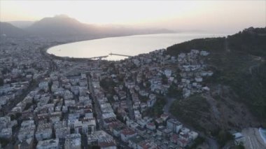 This stock footage shows aerial view of Alanya, Turkey - a resort town on the seashore in 8K resolution
