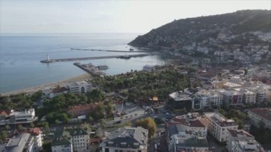This stock footage shows aerial view of Alanya, Turkey - a resort town on the seashore in 8K resolution