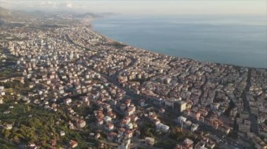 This stock footage shows aerial view of Alanya, Turkey - a resort town on the seashore in 8K resolution