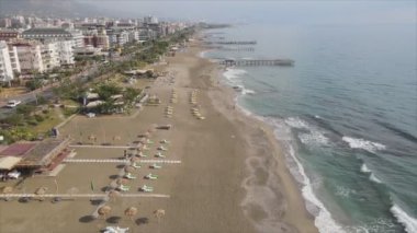 This stock footage shows aerial view of Alanya, Turkey - a resort town on the seashore in 8K resolution