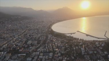 This stock footage shows aerial view of Alanya, Turkey - a resort town on the seashore in 8K resolution