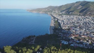 This stock footage shows aerial view of Alanya, Turkey - a resort town on the seashore in 8K resolution