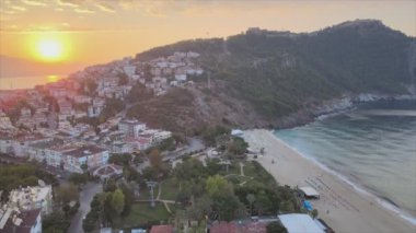 This stock footage shows aerial view of Alanya, Turkey - a resort town on the seashore in 8K resolution