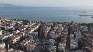This stock footage shows aerial view of Alanya, Turkey - a resort town on the seashore in 8K resolution