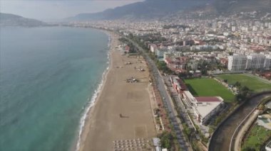 This stock footage shows aerial view of Alanya, Turkey - a resort town on the seashore in 8K resolution